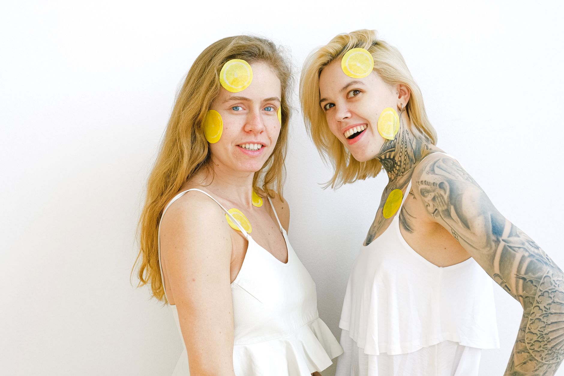 Hands holding pastel-colored silicone vibrators on a light background, symbolizing ownership of personal pleasure